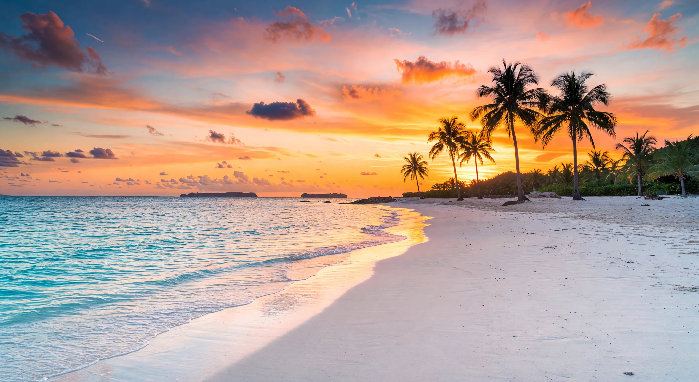 Okinawa pristine beach at sunset, golden light reflecting on calm turquoise water